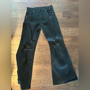 Black distressed wide legged jeans